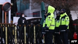 Police officers stand guard near the residence of impeached South Korea president Yoon Suk Yeol in Seoul on Jan. 9, 2025.