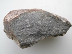A piece of an enstatite chondrite meteorite, which contains about 0.5 weight percent of water, is seen in this undated handout obtained Aug. 27, 2020, courtesy of Laurette Piani and Christine Fieni from the Museum of Natural History in Paris.