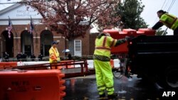 City workers place barricades around the court grounds during the first day of jury selection for the James Fields murder trial at Charlottesville Circuit Court in Charlottesville, Virginia, Nov. 26, 2018.