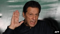 FILE - Former Pakistani Prime Minister Imran Khan speaks to media representatives at his residence in Lahore on May 18, 2023. U.N. experts on July 1, 2024, demanded the release from detention of Khan, who was convicted on corruption charges in August 2023.