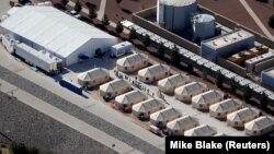 A tent-city compound housing immigrant children is seen next to the Mexican border in Tornillo, Texas, June 18, 2018. The Navy has drafted a memo containing plans for detention centers for adult illegal migrants on military bases, if needed. 