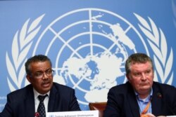 WHO Director General Tedros Adhanom Ghebreyesus speaks next to Michael J. Ryan, executive director of the WHO Health Emergencies Program, during a news conference on coronavirus infection, at U.N. offices in Geneva, Jan. 29, 2020.