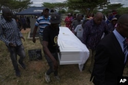 FILE —Opposition supporters carry the coffin with the body of Moreblessing Ali, at her burial on the outskirts of Harare, Saturday, March, 2, 2024.