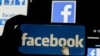 El logo de Facebook aparece en la pantalla de un celular inteligente.