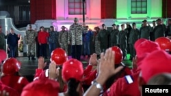 Venezuela’s President Nicolas Maduro administers oaths to members of the Bolivarian Militia and a combatant force, days before he is set to officially begin his third term in office, in Caracas, Venezuela, Jan. 7, 2025.