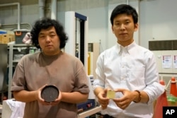Sakai and Machida developed a technology that can transform food waste into "cement" for construction use. (AP Photo/Chisato Tanaka)