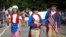 Children in costumes march down Main Street during the annual Fourth of July parade in Barnstable Village on Cape Cod, Massachusetts.