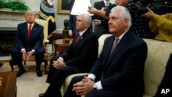 President Donald Trump listens to a question during a meeting with Finnish President Sauli Niinisto in the Oval Office of the White House in Washington, Aug. 28, 2017. From left are, Trump, Vice President Mike Pence, and Secretary of State Rex Tillerson.