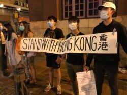 FILE - Hong Kong protesters gather outside the subway station in Sheung Wan district participate the "823 Road for Hong Kong" human chain rally (Photo: Iris Tong / VOA Cantonese)