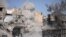 Smoke rises after a landmine is exploded as fighters of Syrian Democratic Forces clear roads after the liberation of Raqqa, Syria, Oct. 18, 2017. 