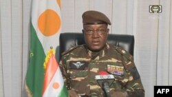 FILE - This video frame grab image obtained by AFP from ORTN - Télé Sahel on July 28, 2023 shows Gen.Abdourahamane Tchiani, Niger’s new strongman, speaking on national television and reads a statement as "President of the National Council for the Safeguarding of the Fatherland."