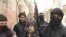 Free Syrian Army fighters train in a neighborhood of Damascus, Syria