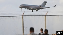 The plane carrying WikiLeaks founder Julian Assange lands at Saipan International Airport following a stopover in Bangkok in Saipan, Northern Mariana Islands, on June 26, 2024, after reaching a plea deal with US authorities.