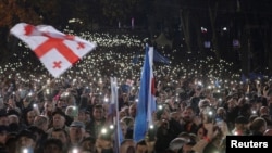 Supporters of the Georgian Dream party attend a final campaign rally ahead of the upcoming parliamentary elections in Tbilisi, Oct. 23, 2024. 