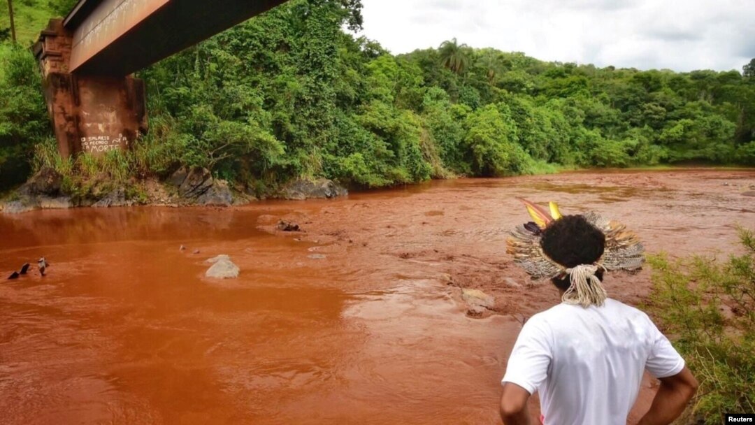 An Indigenous man from the Pataxo Ha-ha-hae tribe looks at Paraopeba river, after a tailings dam owned by Brazilian mining company Vale SA collapsed, in Sao Joaquim de Bicas near Brumadinho, Brazil, Jan. 25, 2019. 