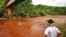 An Indigenous man from the Pataxo Ha-ha-hae tribe looks at Paraopeba river, after a tailings dam owned by Brazilian mining company Vale SA collapsed, in Sao Joaquim de Bicas near Brumadinho, Brazil, Jan. 25, 2019. 