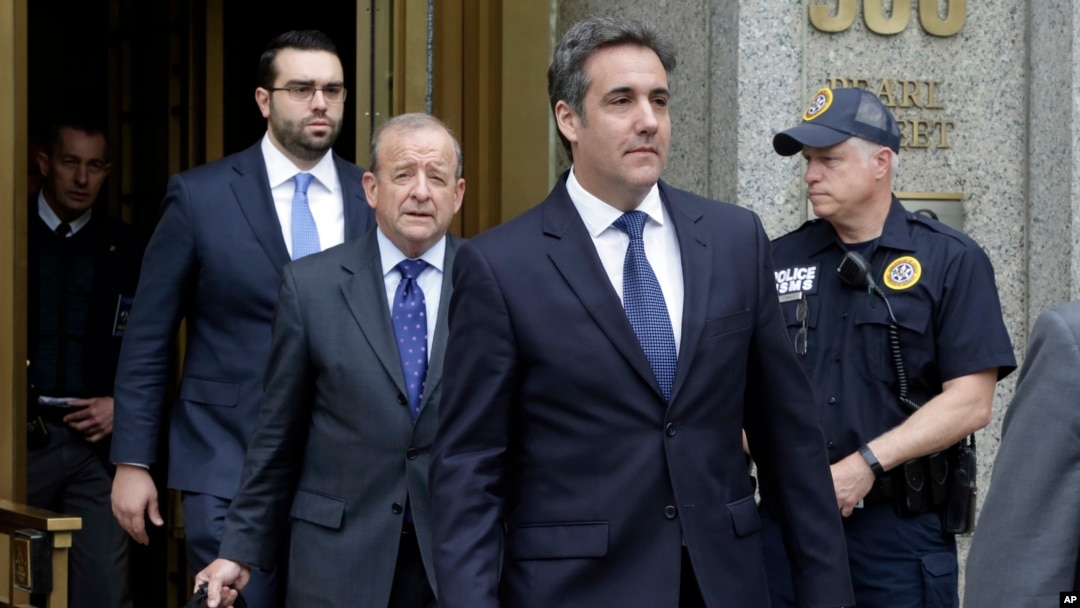 President Donald Trump's personal attorney Michael Cohen (R) and his attorney Stephen Ryan (2nd-L) leave Federal Court, in New York, May 30, 2018. 