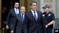 FILE - President Donald Trump's personal attorney Michael Cohen (R) and his attorney Stephen Ryan (2-L) leave Federal Court, in New York, May 30, 2018. 