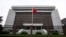 FILE - A Chinese national flag flutters in front of the Shanghai's No. 1 People's Intermediate Court in Shanghai, China.