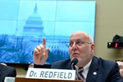 FILE - Centers for Disease Control and Prevention Director Robert Redfield testifies before the House Commerce subcommittee on Capitol Hill in Washington, Feb. 26, 2020.