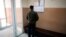 A man looks at a list with job vacancies posted at the entrance of an employment agency in the town of Vratsa, some 110km (68 miles) north of Sofia, Apr. 10, 2013. 