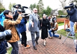 Huawei chief financial officer Meng Wanzhou leaves her Vancouver home with her security detail for an extradition hearing in British Columbia Supreme Court in Vancouver, British Colombia, Jan. 21, 2020.