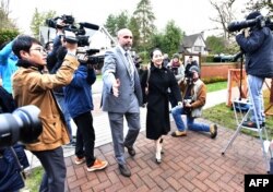 Huawei chief financial officer Meng Wanzhou leaves her Vancouver home with her security detail for an extradition hearing in British Columbia Supreme Court in Vancouver, British Colombia, Jan. 21, 2020.