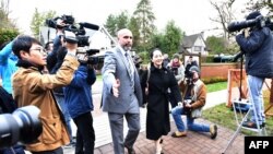 Huawei chief financial officer Meng Wanzhou leaves her Vancouver home with her security detail for an extradition hearing in British Columbia Supreme Court in Vancouver, Jan. 21, 2020.