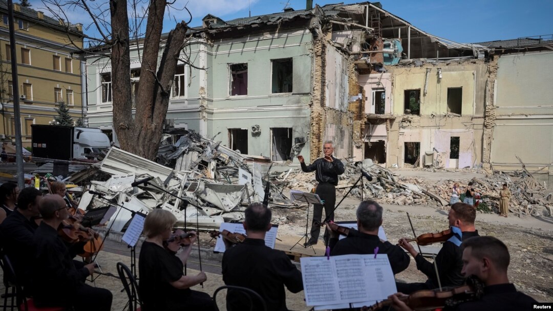 Members of the Kyiv Classic Orchestra perform "Requiem for the Dead" at the ruins of Okhmatdyt children's hospital, which was recently hit by a Russian missile, in Kyiv, Ukraine, July 12, 2024.