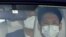 Japanese Prime Minister Shinzo Abe arrives by a car at Keio University Hospital, amid speculation about his health, in Tokyo, Japan, in this photo taken by Kyodo, August 24, 2020.