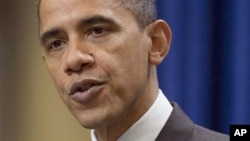 President Barack Obama pauses during a statement about the US-Korea Free Trade Agreement on in Washington, 04 Dec 2010