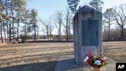 FILE - A memorial stands in the University of Mississippi campus cemetery, March 5, 2019. The university plans to relocate a Confederate soldier statue to the Civil War cemetery.