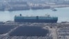 Vehicles are parked to be exported at a port next to Hyundai Motor's manufacturing facility in Ulsan, South Korea, Feb. 11, 2025. 