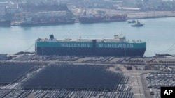 Vehicles are parked to be exported at a port next to Hyundai Motor's manufacturing facility in Ulsan, South Korea, Feb. 11, 2025. 