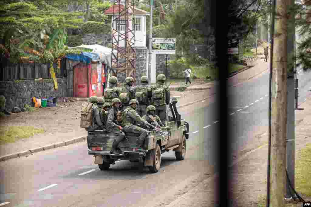 Armed men drive through a street in Goma, Democratic Republic of Congo, Jan. 28, 2025.&nbsp;Gunshots rang out through parts of the besieged city of Goma as Congolese soldiers clashed with militia fighters backed by Rwandan troops.