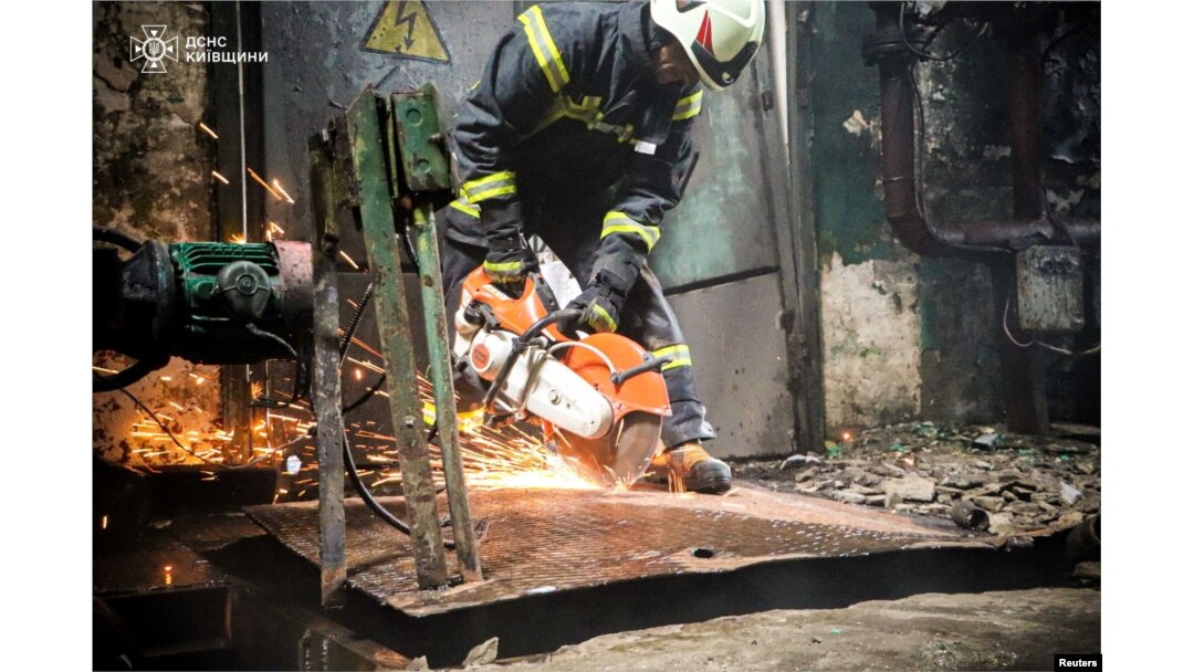 A Ukrainian rescuer works at the site of a Russian military strike in the Kyiv region on April 11, 2024. (Press service of the State Emergency Service of Ukraine via Reuters)