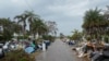 Debris from Hurricane Helene lines a street in the Redington Beach section of St. Petersburg, Florida, on October 8, 2024, ahead of Hurricane Milton's expected landfall.