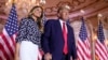 Former President Donald Trump stands on stage with former first lady Melania Trump after he announced a run for president for the third time at Mar-a-Lago in Palm Beach, Fla., Tuesday, Nov. 15, 2022. 