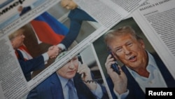 Daily newspapers with covers dedicated to the recent phone call of Russian President Vladimir Putin and U.S. President Donald Trump are laid out at a newsstand in a street in Moscow, Russia, Feb. 13, 2025.