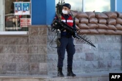 A Turkish soldier patrols next to the entrance of the Sincan Penal Institution at the 4th Heavy Penal Court near Ankara, on Nov. 26, 2020.
