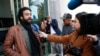 FILE - Moroccan journalist and activist Omar Radi speaks to the media after his hearing at the Casablanca Courthouse, In Casablanca, Morocco, March 5, 2020.