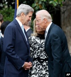 FILE - Secretary of State John Kerry, left, talks with Vice President Joe Biden on Sept. 25, 2015, on the South Lawn of the White House in Washington.
