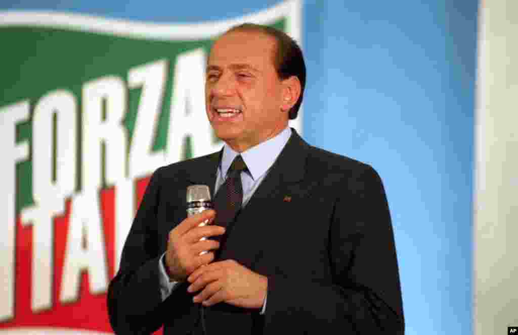 Founded Forza Italia political party in 1994 and was elected prime minister - resigning seven months later following charges of conflict of interest and tax fraud. A conviction on those charges was later overturned. (AP Photo)