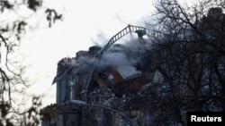 A view shows a residential building damaged during a Russian drone strike in Kyiv, Ukraine, Jan. 1, 2025.