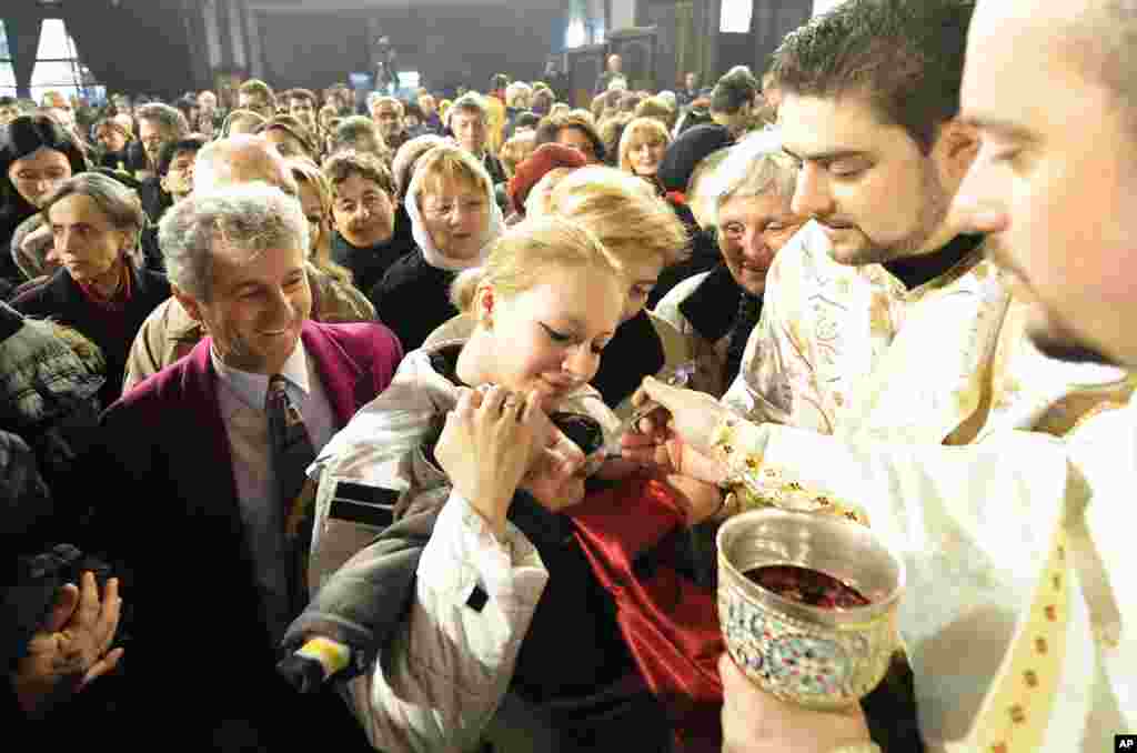 A child receives the sacraments during a Christmas liturgy in St. Clement Cathedral in Macedonia's capital Skopje, January 7, 2012.  (Reuters)