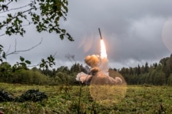 FILE - This undated file photo provided Sept. 19, 2017, by Russian Defense Ministry official web site shows a Russian Iskander-K missile launched during a military exercise at a training ground at the Luzhsky Range, near St. Petersburg, Russia.