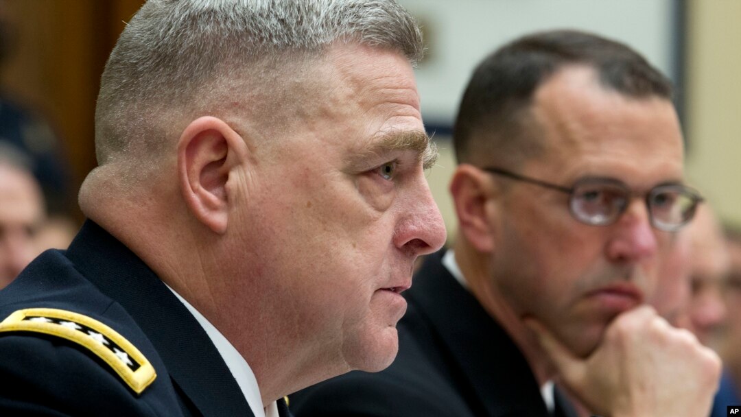 FILE - Army Chief of Staff Gen. Mark A. Milley, accompanied by Chief of Naval Operations Adm. John M. Richardson, testifies on Capitol Hill in Washington, April 5, 2017.