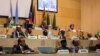 African Union chairman Moussa Faki (2nd L-top) is seen sitting with members of the Intergovernmental Authority for Development (IGAD) as they attend a signing ceremony for the cease-fire agreement amongst South Sudanese parties to end the four-year war in the country, at the headquarters of African Union in the Ethiopian capital Addis Ababa, Dec 21, 2017.