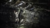 (FILES) A miner works underground, at the Anglo American Bathopele Mine in Runstenburg, North Western Province of South Africa, some 170 km from Johannesburg on June 11, 2015.