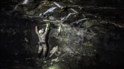 (FILES) A miner works underground, at the Anglo American Bathopele Mine in Runstenburg, North Western Province of South Africa, some 170 km from Johannesburg on June 11, 2015.